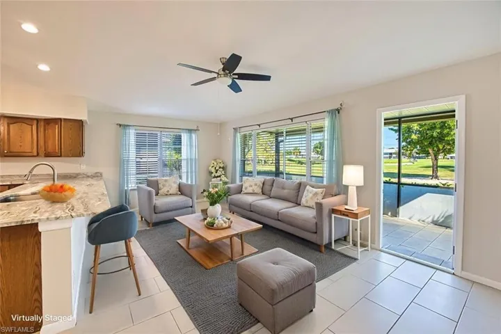 *VIRTUALLY STAGED*Living area featuring light tile patterned floors, recessed lighting, and ceiling fan