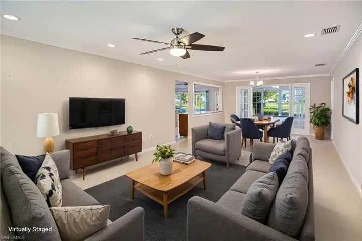 *VIRTUALLY STAGED*Living area featuring recessed lighting, crown molding, and a ceiling fan