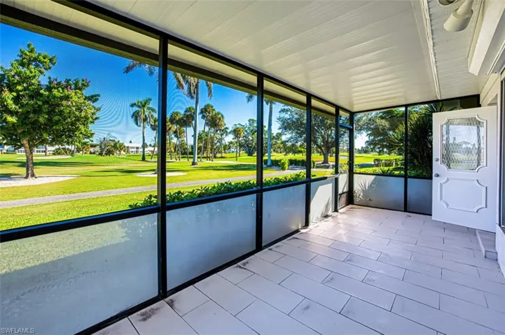 Unfurnished sunroom with golf course view