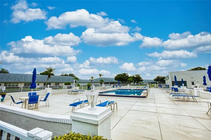 Community pool featuring a patio