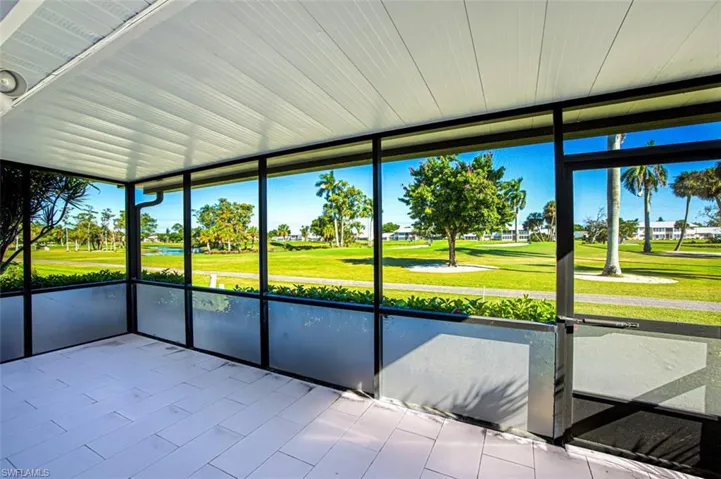 Unfurnished sunroom with golf course view