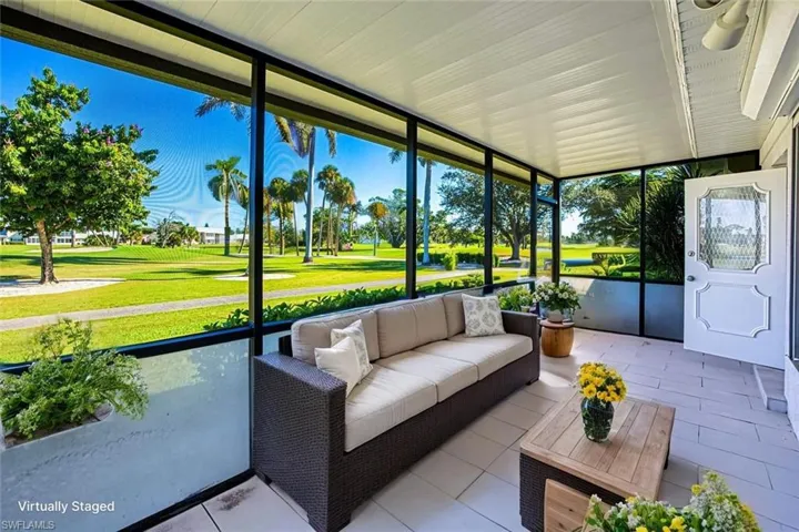 *VIRTUALLY STAGED*Sunroom / solarium with outdoor lounge area and golf course view