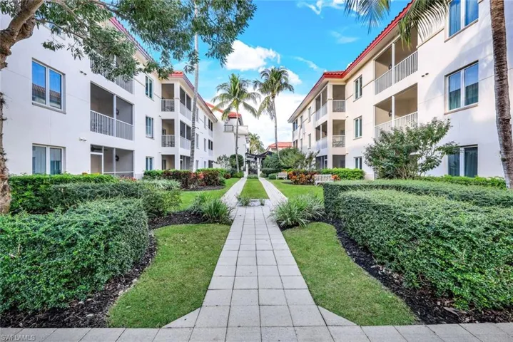 View of home's community with a lawn