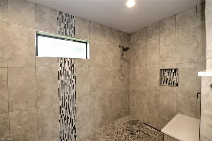 Bathroom with a tile shower