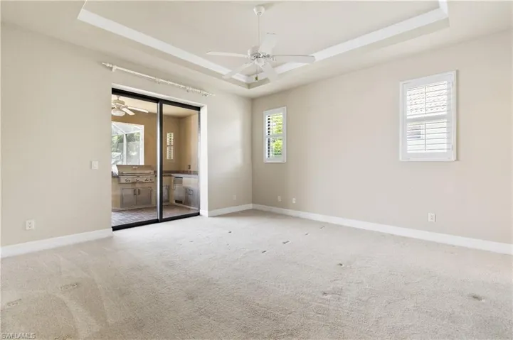Primary bedroom overlooks lake