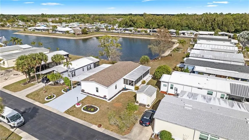 Aerial view of residential area featuring a large body of water