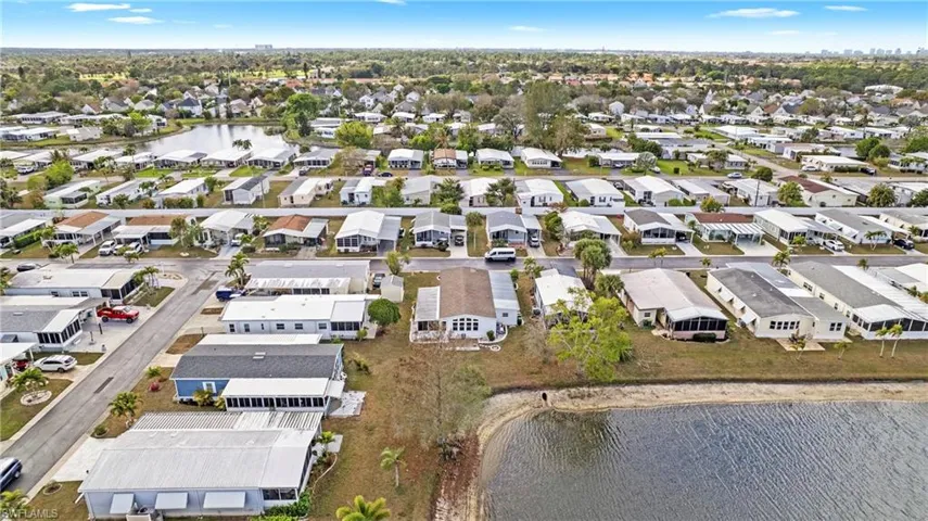 Aerial perspective of suburban area with a large body of water