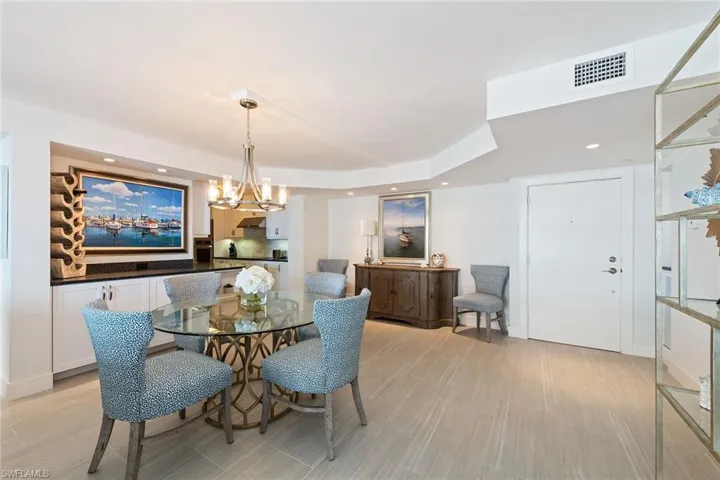 Dining space with a chandelier and recessed lighting