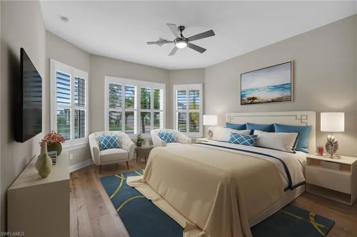 Bedroom featuring hardwood / wood-style floors and ceiling fan