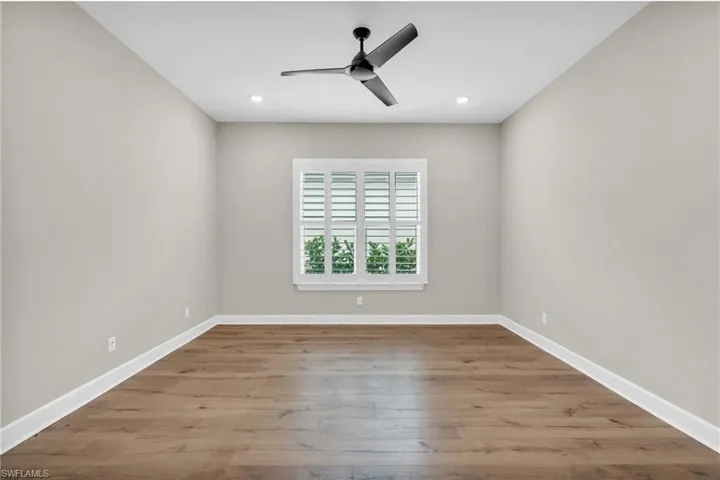 Spare room featuring light hardwood / wood-style flooring and ceiling fan