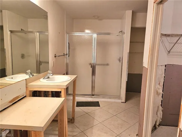 Bathroom with tile floors,double sink plumbing, separate shower & tub