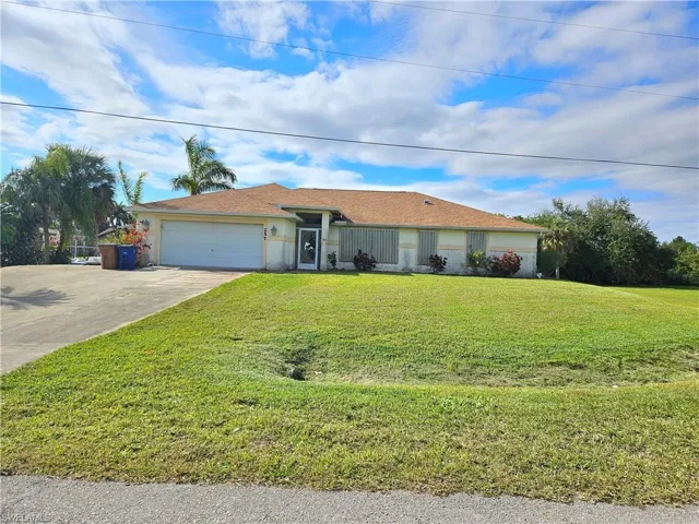 Ranch-style house with extra large driveway for additional parking