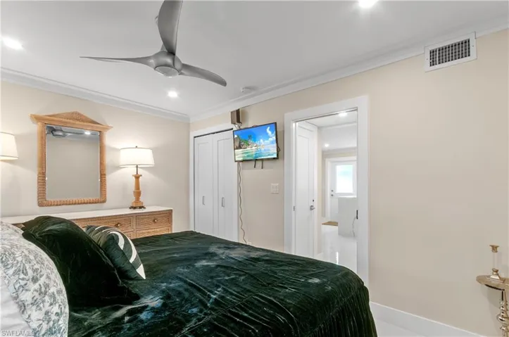 Bedroom featuring crown molding, a closet, ceiling fan, and recessed lighting