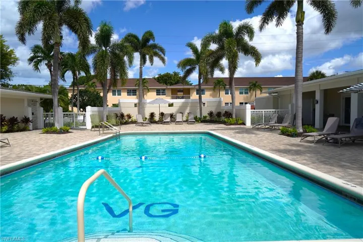 Community pool featuring a patio