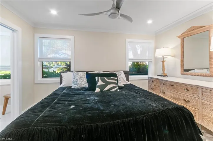 Bedroom with ornamental molding, a ceiling fan, and recessed lighting