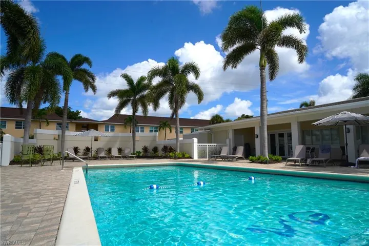 Community pool with a patio area