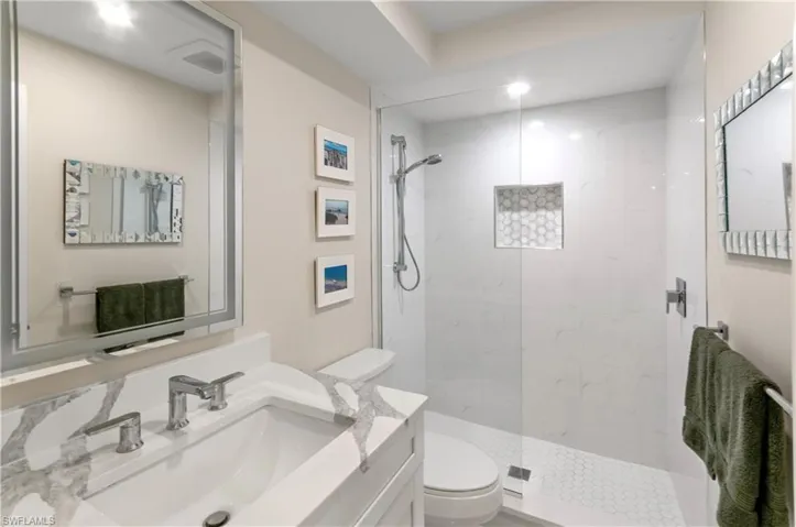 Full bath featuring vanity and a walk in shower