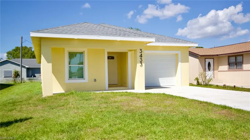 View of front of property featuring a front lawn, stucco siding, roof with shingles, and an attached garage