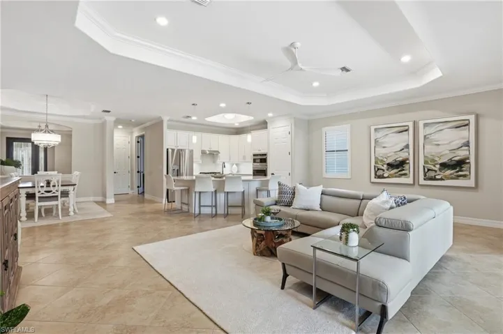 Open concept living space featuring neutral wall tones and tile flooring
