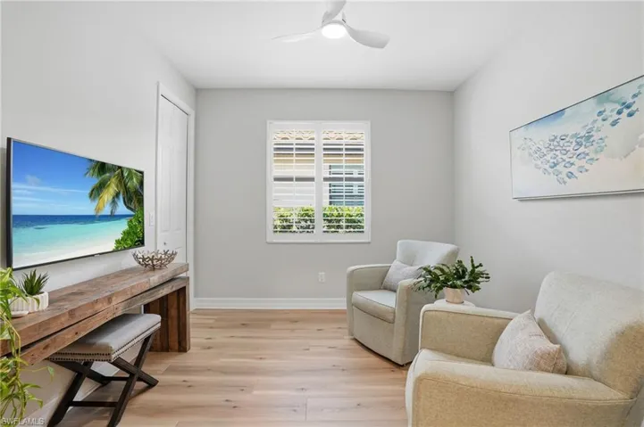 Light wood-finish flooring complements the neutral wall tones