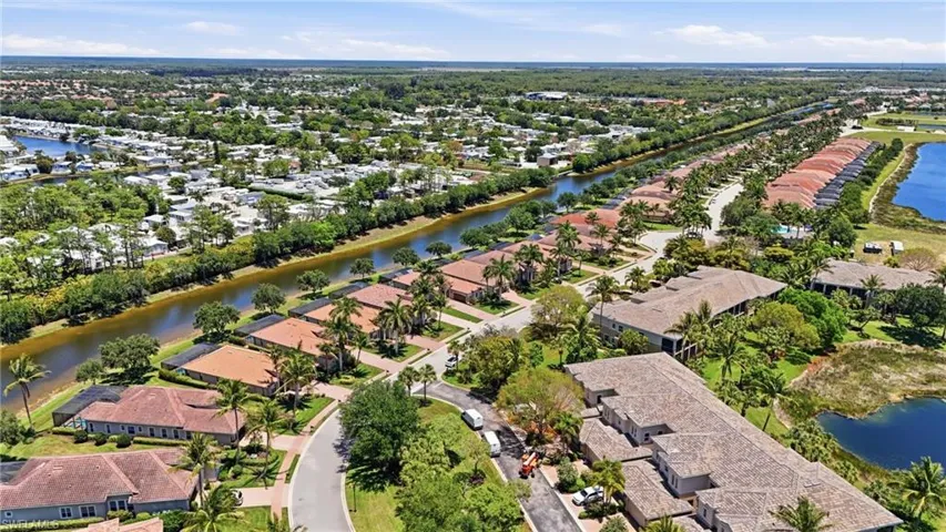 Aerial perspective showcasing a residential community with abundant green landscaping