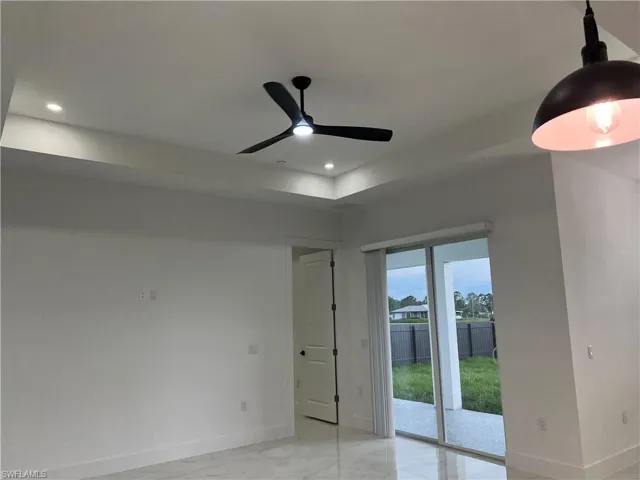 Empty room with ceiling fan and recessed lighting