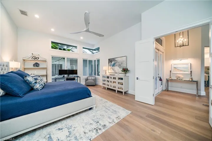 Bedroom featuring ceiling fan and light wood flooring