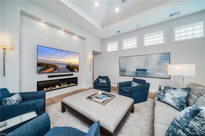 Main Living room featuring a high ceiling, built in fireplace