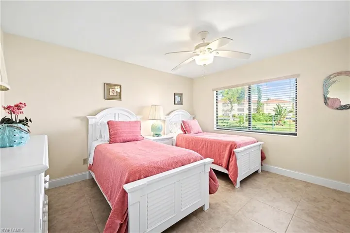 guest room with porcelain tile and plenty of natural light