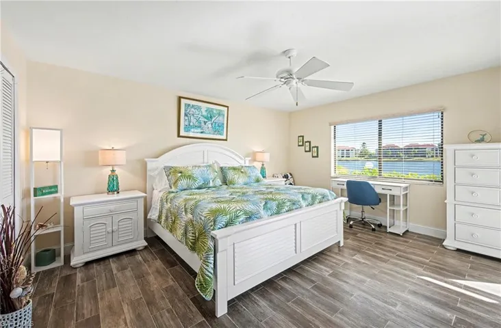 Spacious primary bedroom with coastal decor
