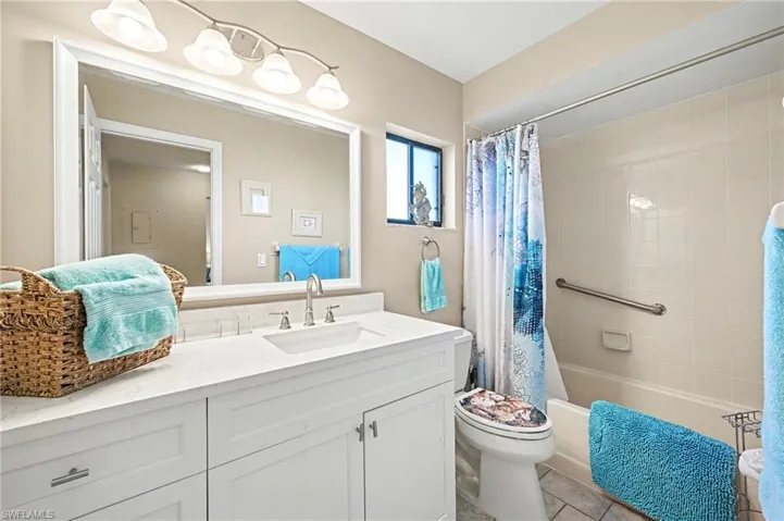 Window brings in natural light in guest bath
