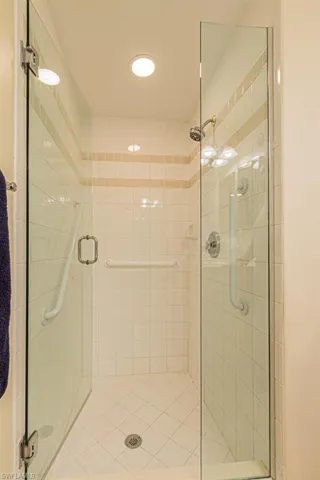 Bathroom with a shower with door