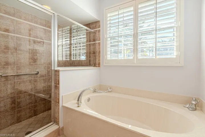 Bathroom featuring plus walk in shower