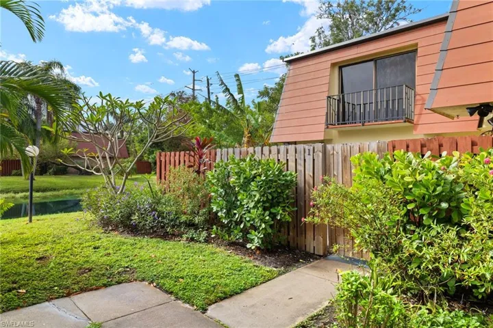 A-frame property exterior with a private balcony featuring an iron railing