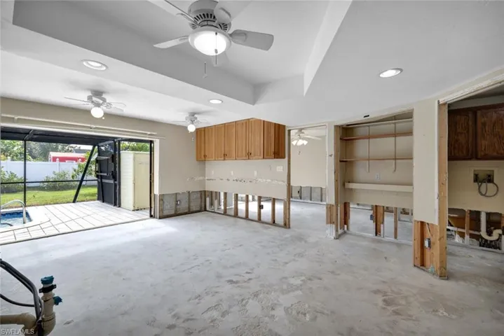 Kitchen features pool views.