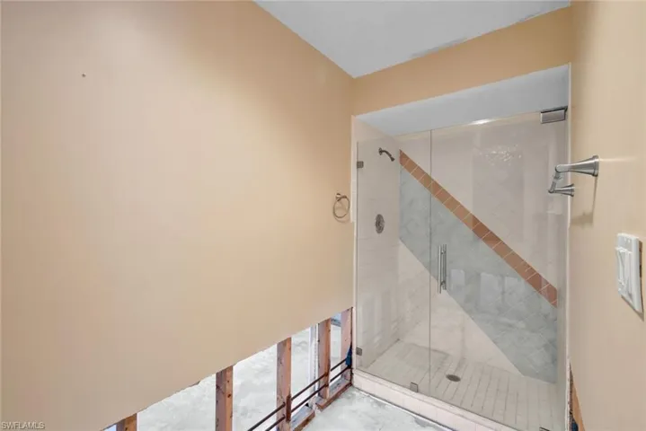 Primary bathroom features a walk-in shower.