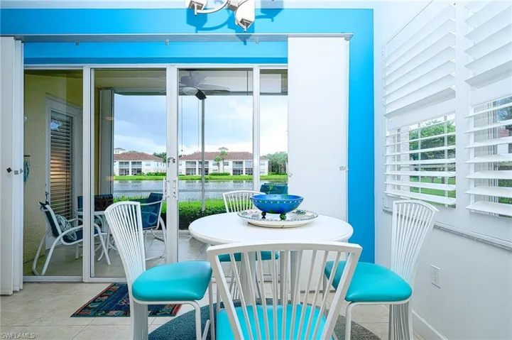 View of lake from kitchen, patio door with custom covering