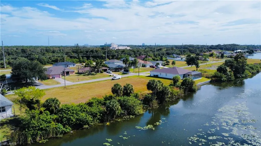 Aerial perspective of suburban area with a large body of water