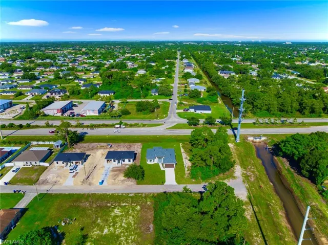 Aerial overview of property's location with nearby suburban area