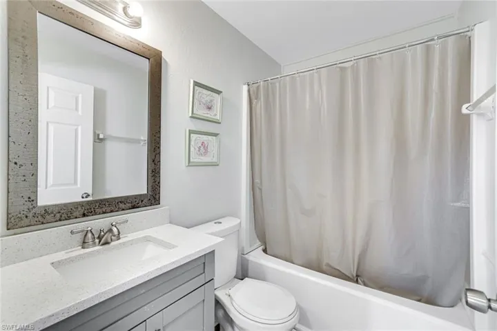 Full bathroom with vanity and shower / tub combo
