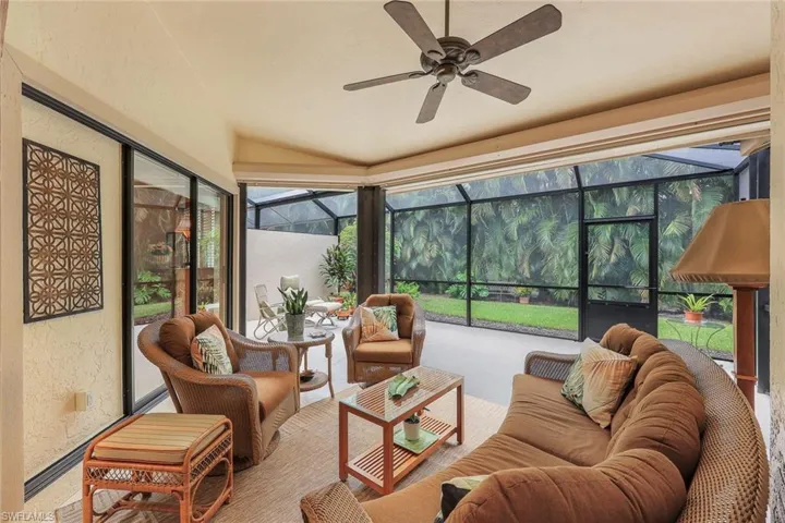 Lanai/sunroom with ceiling fan and  lofted ceiling