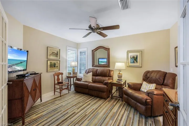Living room featuring ceiling fan
