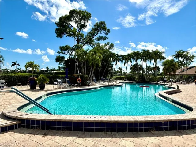 One of 9 Community pools. This pool adjacent the clubhouse offers a large patio area with cabana, plenty of  chairs and lounges relax and to bask in the Florida sunshine