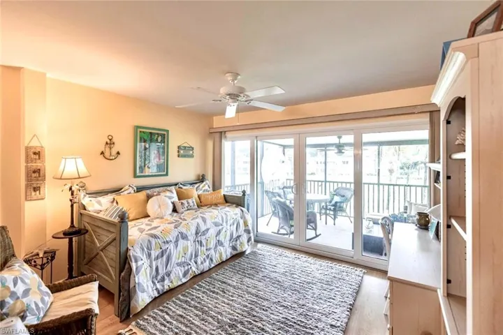 Living area with multiple windows, slider door leading to  screened lanai