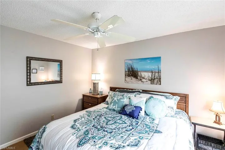 Guests will enjoy their roomy bedroom framed with palm tree views