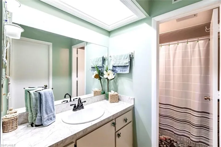 Bathroom featuring vanity and shower
