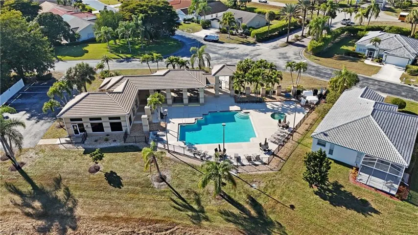 Aerial perspective of suburban area with a pool