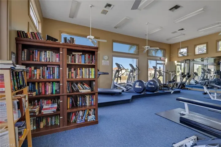 Exercise room featuring a high ceiling