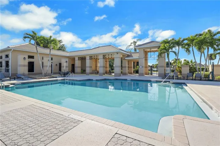 Community pool with a patio
