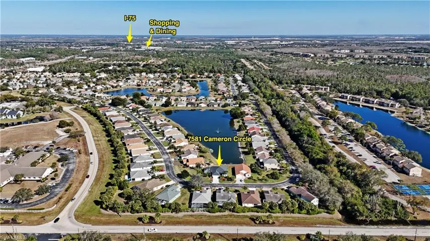 View of property location with nearby suburban area and a large body of water